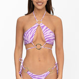 Front view of model wearing lilac and purple Sunset Safari print halter neck Nisa bikini top and matching adjustable Brazilian cut Nisa bikini bottom by Aventura Swimwear.