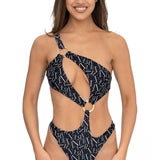 Front view of model wearing black signature print asymmetrical one shoulder Petra onepiece swimsuit by Aventura Swimwear.