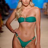 Model at swimwear week in green bikini