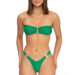 Front view of model wearing iguana green bandeau Lola bikini top and matching Brazilian cut bikini bottom by Aventura Swimwear. 