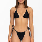 Front view of model wearing matching obsidian black Mila triangle bikini top and string bikini bottom by Aventura Swimwear. 