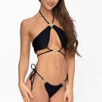 Front view of model wearing obsidian black halter neck Nisa bikini top and matching adjustable Brazilian cut Nisa bikini bottom by Aventura Swimwear. 