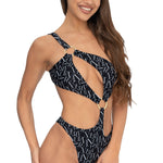 Front view of model wearing black signature print asymmetrical one shoulder Petra onepiece swimsuit by Aventura Swimwear. 