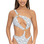 Front view of model wearing white signature print asymmetrical one shoulder Petra onepiece swimsuit by Aventura Swimwear. 