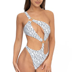 Front view of model wearing white signature print asymmetrical one shoulder Petra onepiece swimsuit by Aventura Swimwear. 