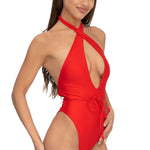 Front view of model wearing red halter neck Selena onepiece swimsuit by Aventura Swimwear. 