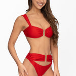 Front view of model wearing ruby red Seraphina bralette bikini top and matching high waist cheeky cut Seraphina bikini bottom by Aventura Swimwear. 