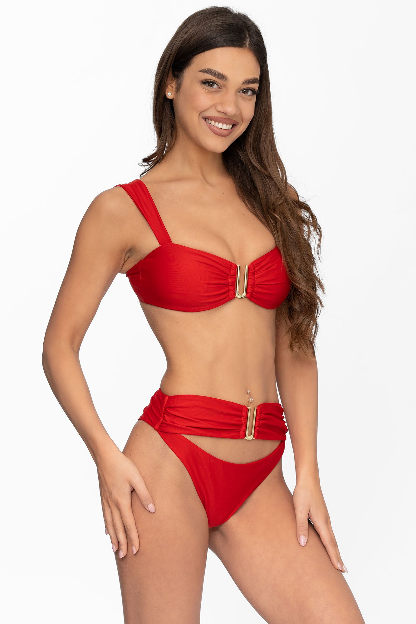 Front view of model wearing ruby red Seraphina bralette bikini top and matching high waist cheeky cut Seraphina bikini bottom by Aventura Swimwear. 