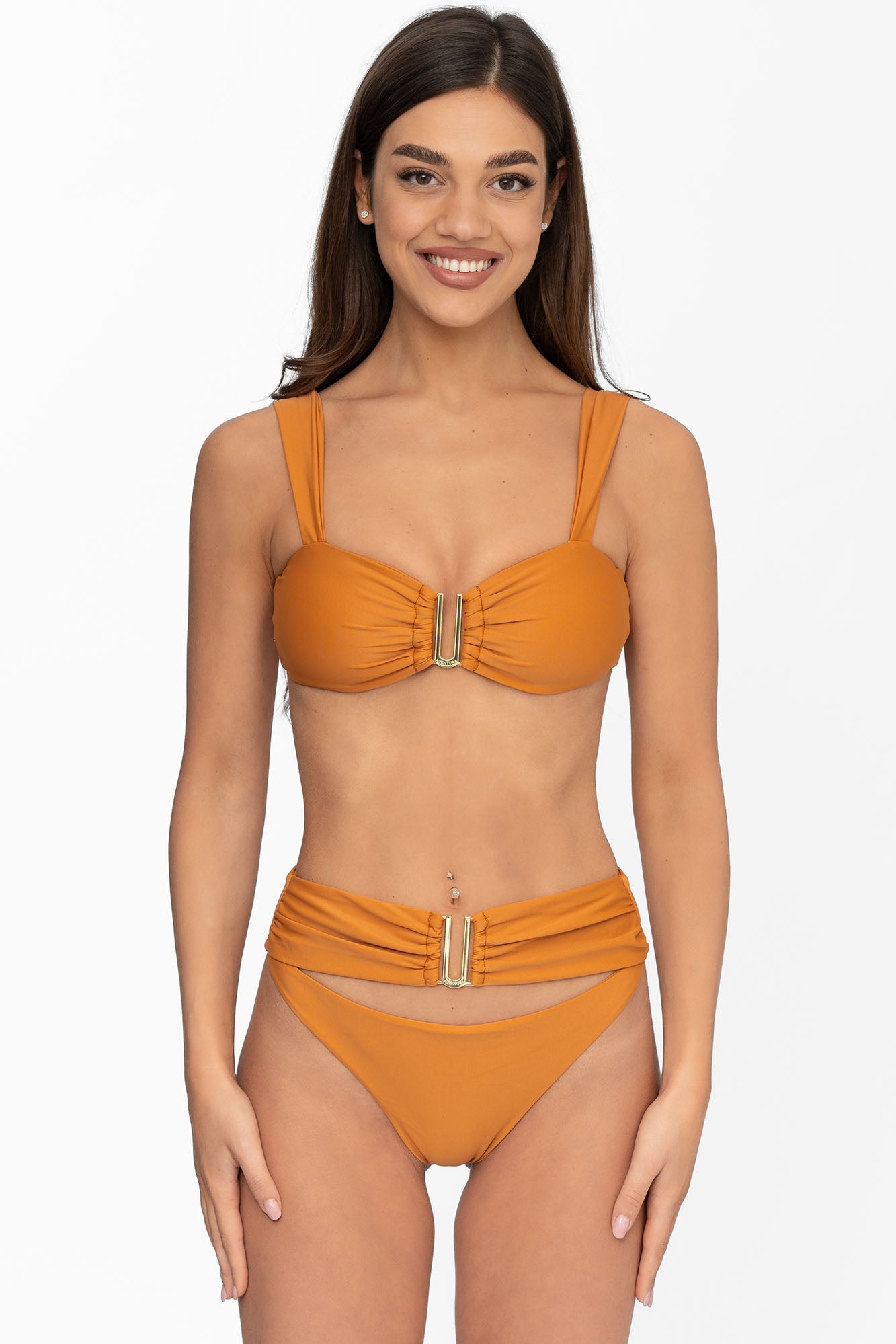 Front view of model wearing terra glow Seraphina bralette bikini top and matching high waist cheeky cut Seraphina bikini bottom by Aventura Swimwear. 