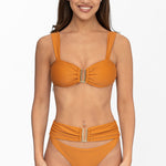 Front view of model wearing terra glow Seraphina bralette bikini top and matching high waist cheeky cut Seraphina bikini bottom by Aventura Swimwear. 