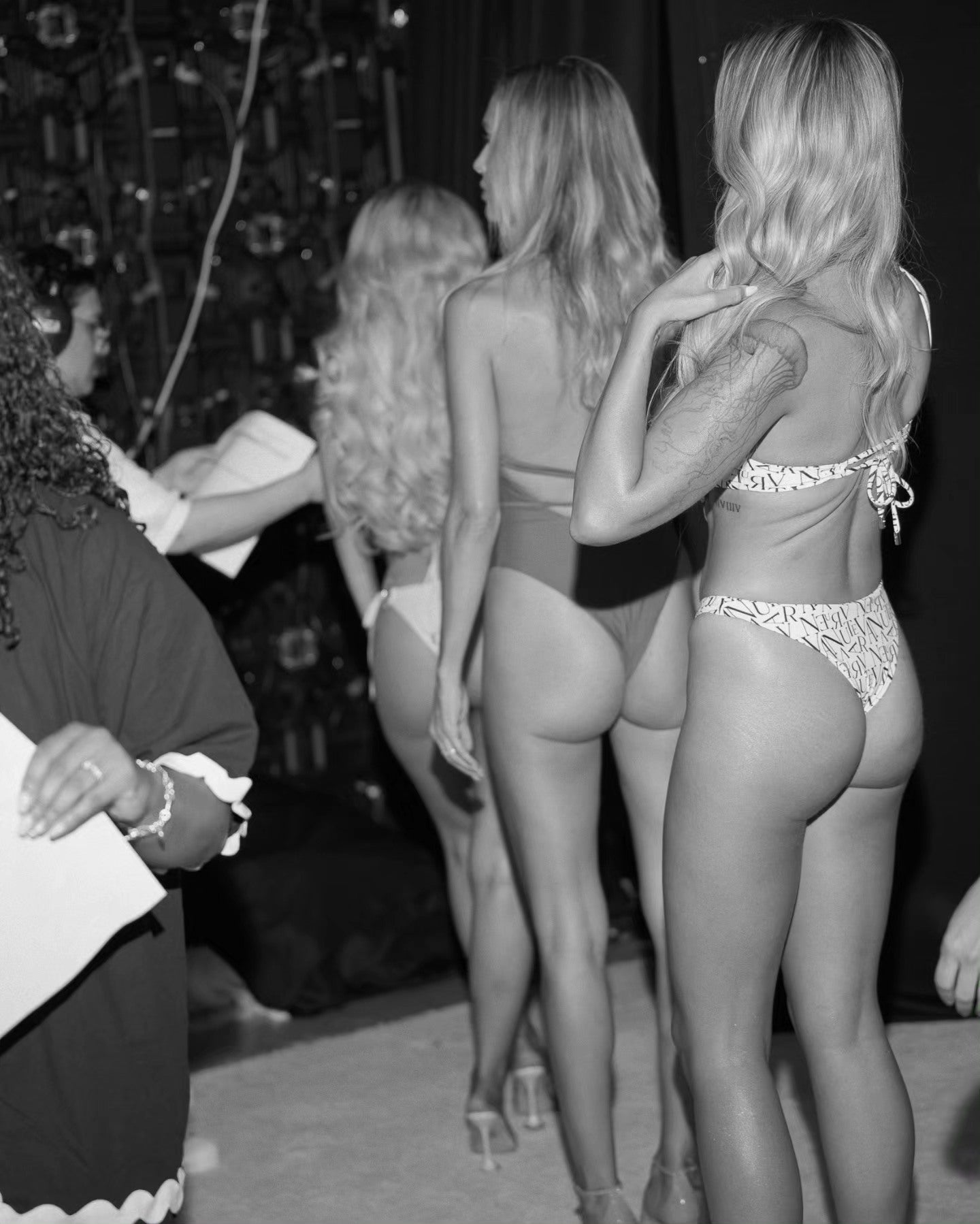 Models about to enter the runway at Aventura Swimwear's runway show for fashion week.