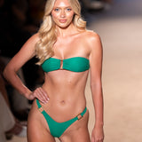 Model shot from Miami swimwear week in green bikini